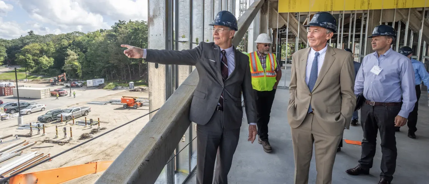 Members of the U N E community take a tour of the construction of the Harold and Bibby Center for Health Sciences on U N E's Biddeford campus